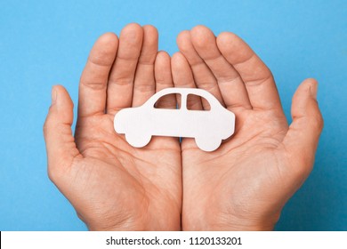 Car Insurance. Man Is Holding Car