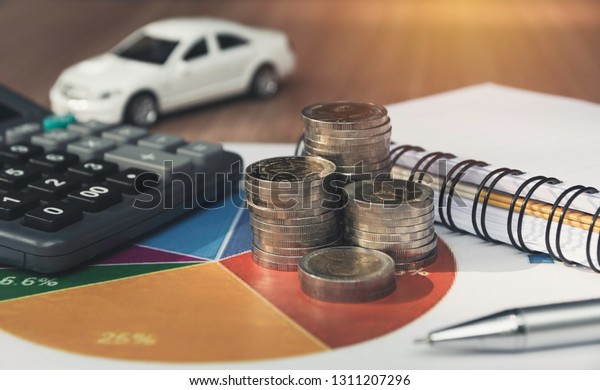 Car insurance and car service. Toy car for\
accounting and financial\
concept.