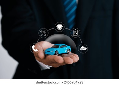 Car insurance services concept.Businessman agent holding car model with insurance icon. Car protection and safety assurance concept. - Powered by Shutterstock