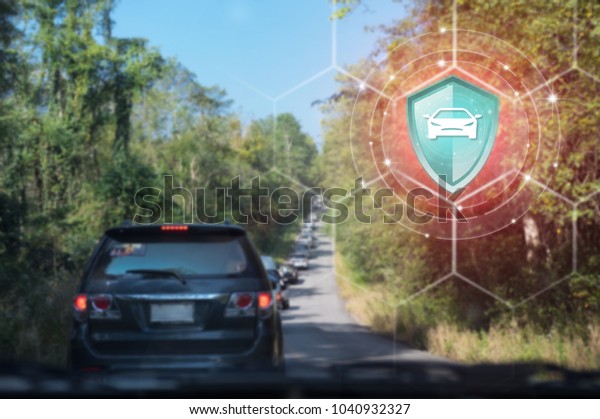 Car Insurance, Shield protection vehicle on\
virtual screen against Traveling with many cars is a vehicle,\
Online insurance digital\
technology.