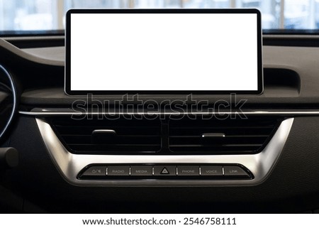 Car interior background. Multimedia touchscreen system in a modern luxury car. Blank white screen.