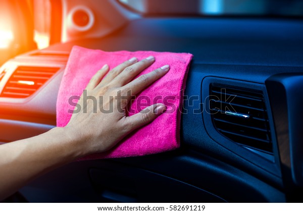 Car interior cleaning by hand with microfiber\
cloth, Car care interior cleaning.\
