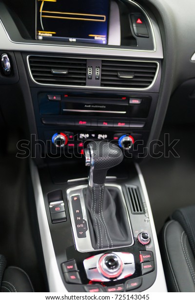 Car\
interior, cockpit, gearshift. Selective focus.\
