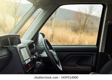 Car Interior Of Driver Seat With Nature View Outside