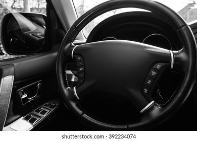 Car Interior. Driving Wheel Close Up. Black And White.