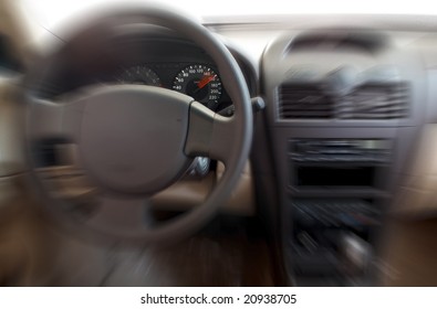 Car interior with focus on speedometer showing 160 km/h