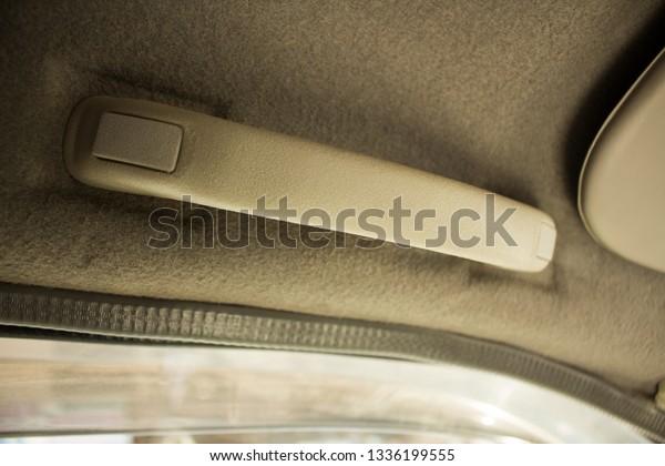 Car interior, Hand Holding Plastic Car\
Grab Handler for The Passenger in A Car -\
Image