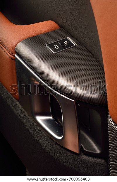 car\
interior handle in luxury car orange color\
leather