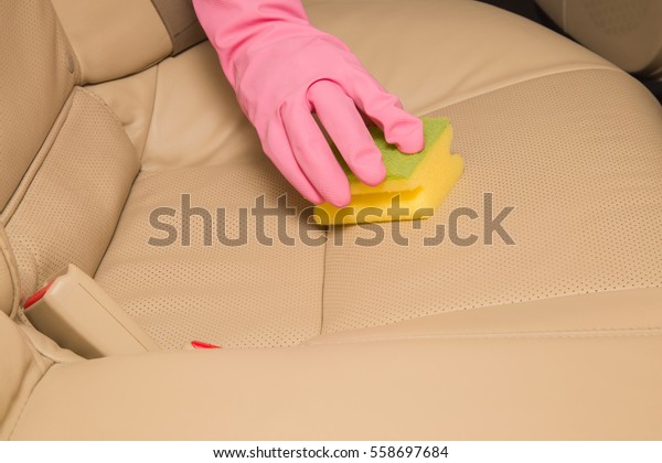 Car\
interior leather seats professionally chemical cleaning with\
sponge. Early spring cleaning or regular clean\
up.
