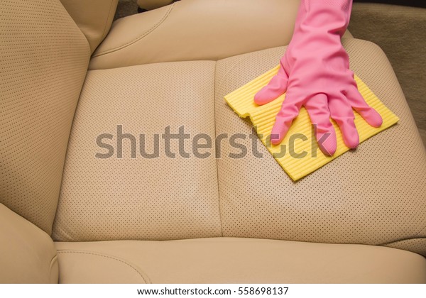 Car interior\
leather seats professionally chemical cleaning with cloth. Early\
spring cleaning or regular clean\
up.