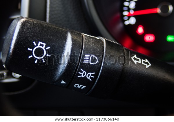 Car interior with light switch,\
car button controller with selective focus and crop\
fragment