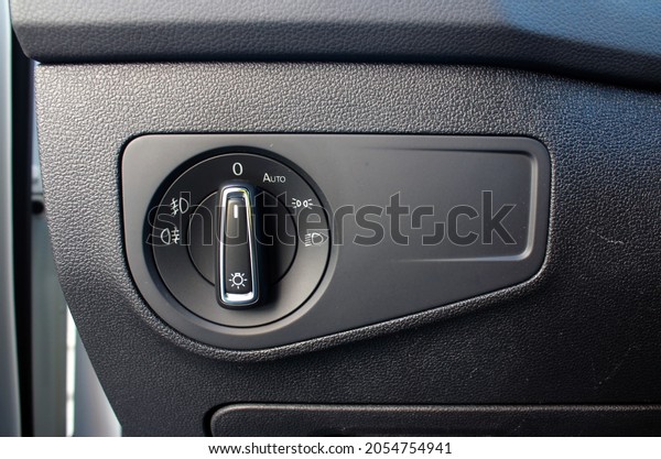 Car\
interior with light switch. Modern car headlight controls.\
Automobile interior detail. Car fog lights\
switch.