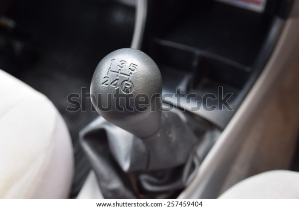 Car interior.\
manual transmission gear\
shift.