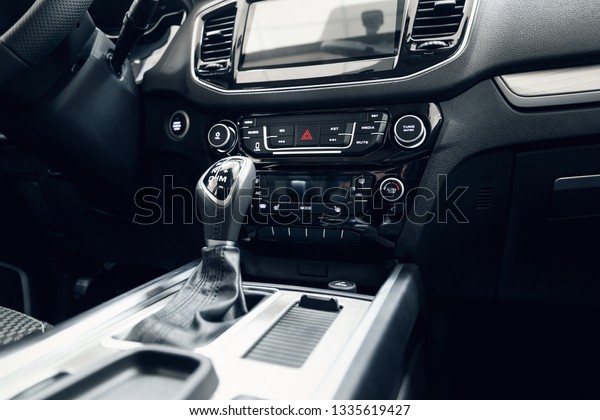 Car
interior. Modern car illuminated dashboard. Luxurious car
instrument cluster. Close up shot of automobile instrument panel.
Modern car interior dashboard and steering
wheel