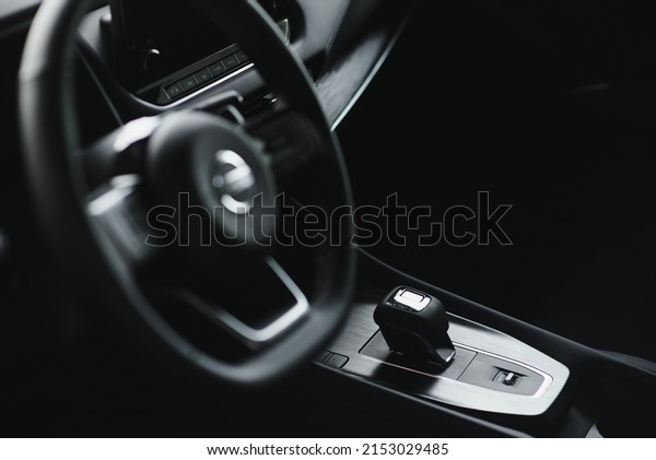 car interior. Modern car speedometer\
and illuminated dashboard. Luxurious car instrument cluster. Close\
up shot of hybrid car instrument\
panel.