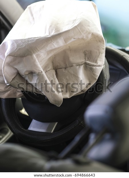 Car interior with the\
opened air bag