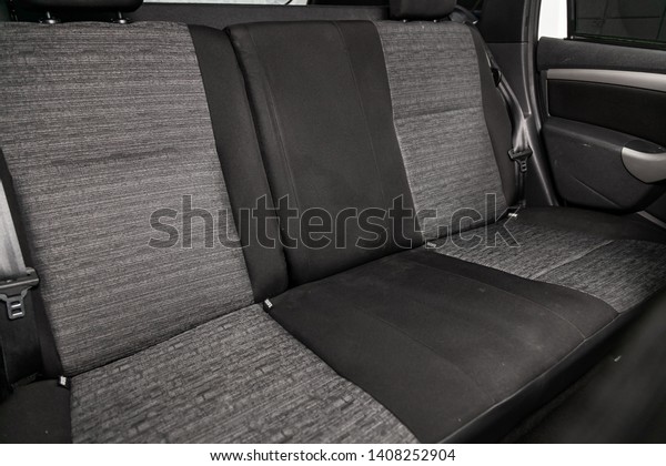 Сlose-up of the car   interior:   rear seats and seat\
belts . 