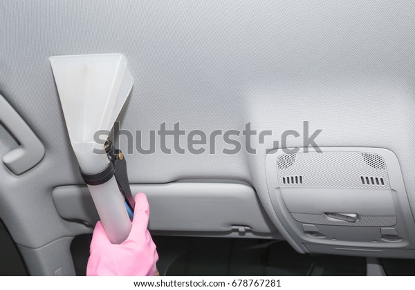 Car interior textile ceiling chemical cleaning with\
professionally extraction method. Early spring cleaning or regular\
clean up.