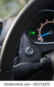Car interior with turn signal switch (selective focus on signal switch) 