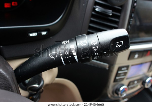 Car interior with wipers switch. Modern\
car wipers controls. Automobile interior\
detail.
