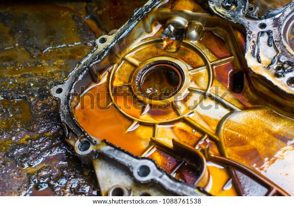 Car\
internal combustion engine cover with oil\
stains.
