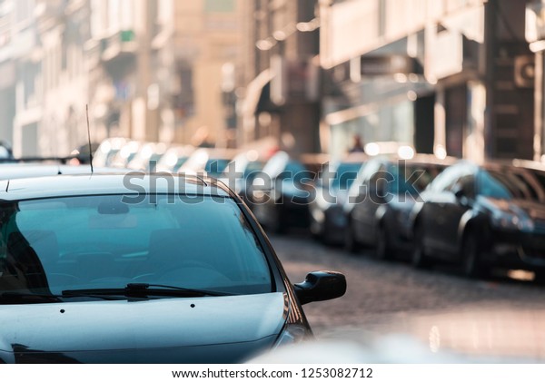 car isolated on street. car\
windshield close up. street scene full of cars with bokeh\
lights.