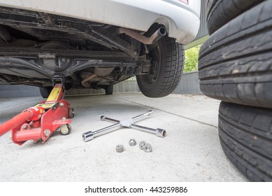 Car jack to lift car, changing car tire