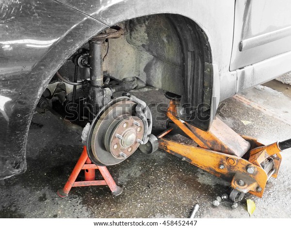 Car jack for Repair Car\
brakes 