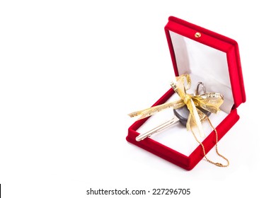 Car Key With Bow In Red Gift Box On A White Background