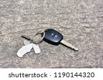 Car key drop on the road background.Car key lost on the road