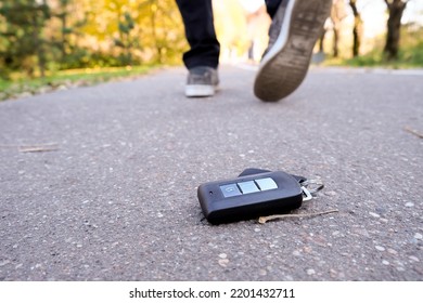 Car Key Fall On The Asphalt Road, Driver Unlucky Man Lost His Vehicle Keys And Walks Away, Misfortune Concept