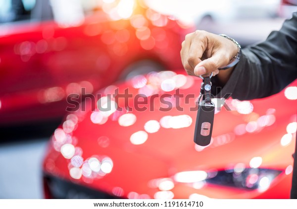 Car key
in hand, Auto dealership and rental
concept