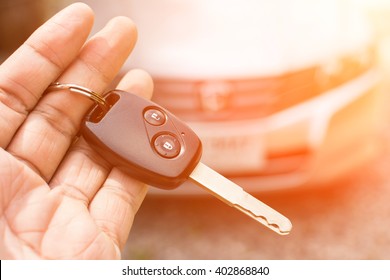 Car key in hand and color tone effect - Shutterstock ID 402868840