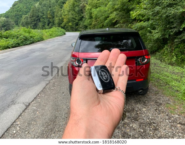 Car key in hand Land Rover Discovery sport.\
Travel Ukraine Carpathian\
08.18.2020