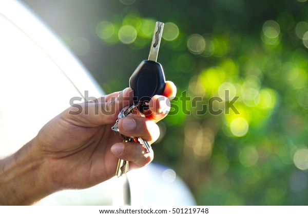 car key in hand\
man