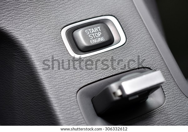 Car key and ignition
button