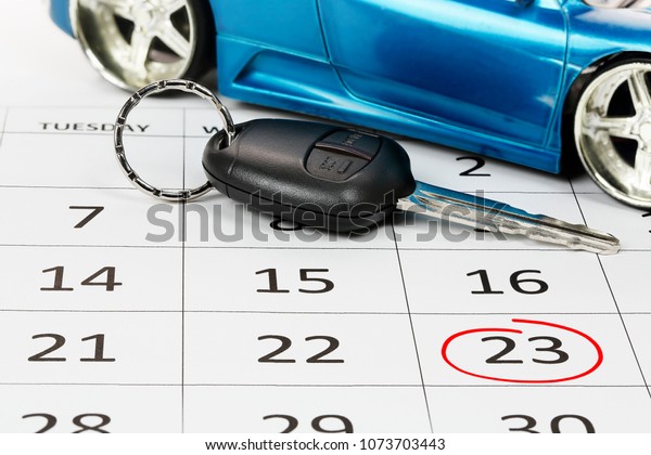 car\
key on calendar and circled date, concept for new\
car