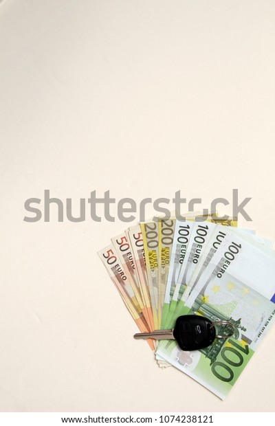 Car key on Euro\
money background.Concept photo of money, banking ,currency and\
foreign exchange rates.