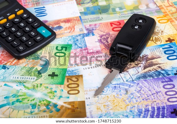  Car key on a Swiss\
money background
