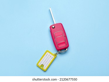 Car Key With Plastic Tag On Blue Background
