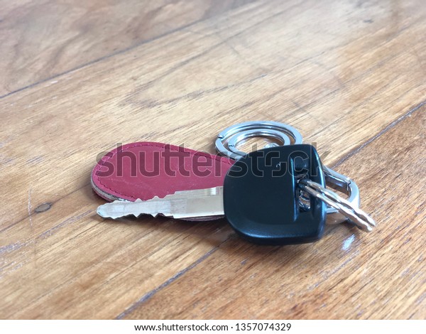 Car key ring on wood\
background