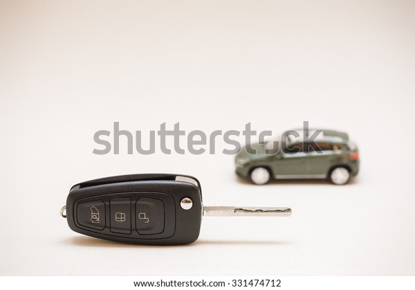 Car key, small car,\
money.
