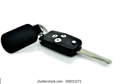 Car Key With Wireless Remote And Leather Tag On White Background