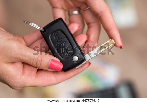 car key in woman\
hand