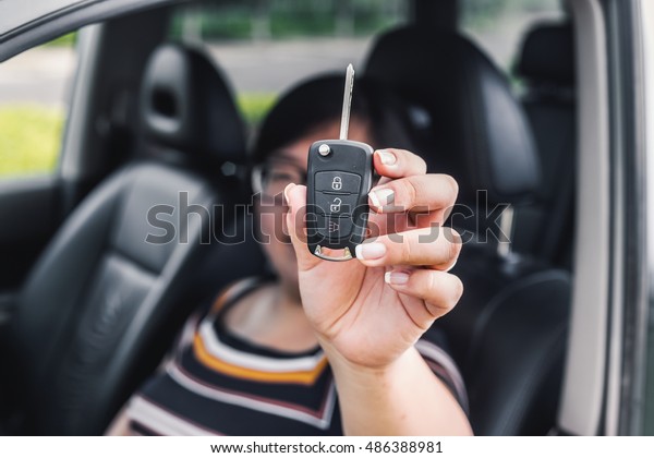 Car key in woman\'s hand\
nice shot