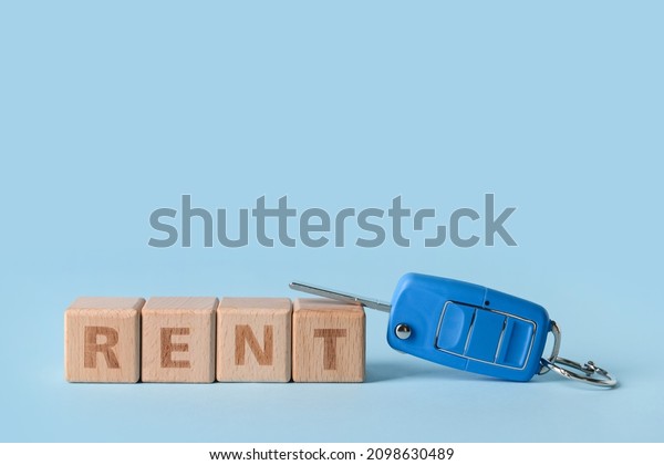 Car key with word\
RENT on blue background