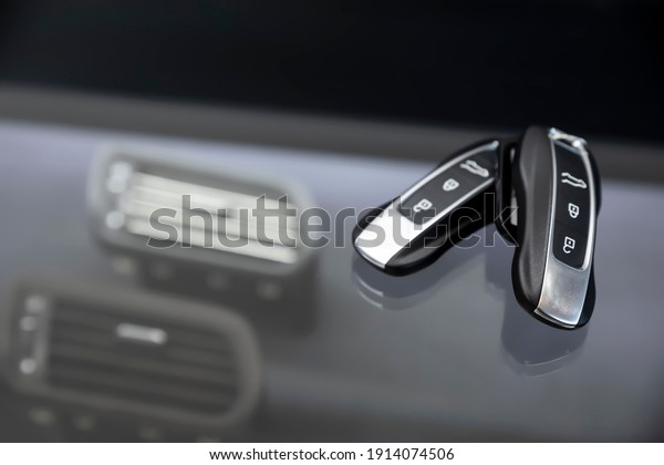 Car\
keyring and remote control key in vehicle\
interior.