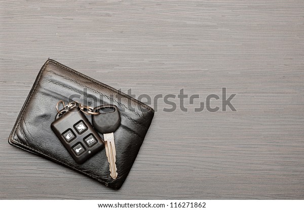 car keys and
documents on dark wooden
background
