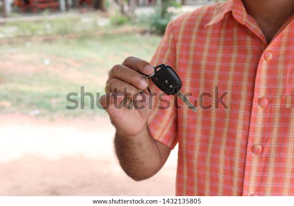 Car keys in hand, handing over to your loved\
ones For driving with\
confidence
