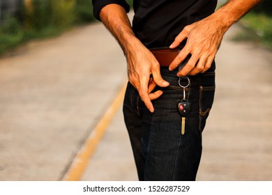 Car Keys Hanging On Brown Belts